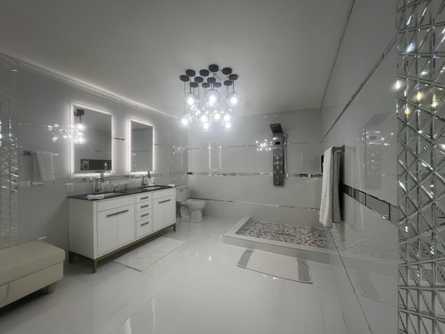 bathroom with a shower, tile walls, vanity, and toilet