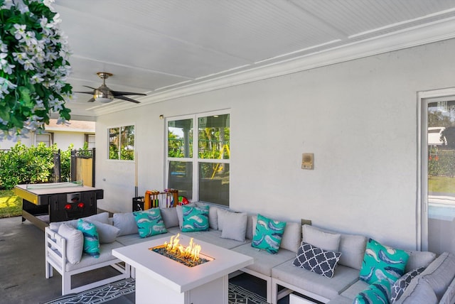 view of patio featuring an outdoor living space with a fire pit and ceiling fan