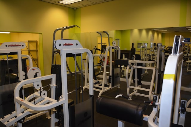 gym featuring a paneled ceiling