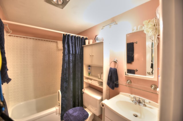 full bathroom featuring shower / tub combo, vanity, and toilet