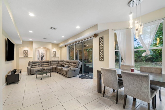 tiled living room featuring a healthy amount of sunlight