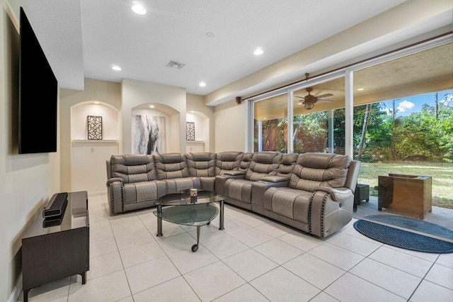 tiled living room with a textured ceiling