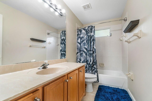 full bathroom featuring shower / bathtub combination with curtain, vanity, a textured ceiling, tile patterned floors, and toilet