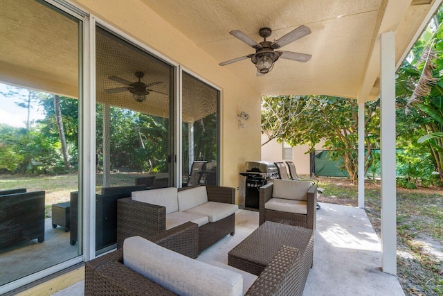 view of patio featuring grilling area, an outdoor hangout area, and ceiling fan