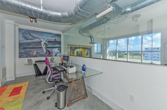 office area featuring concrete flooring