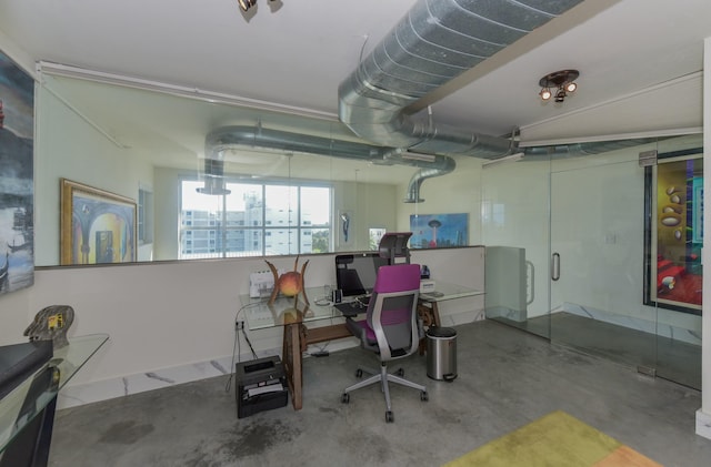 office space featuring concrete flooring