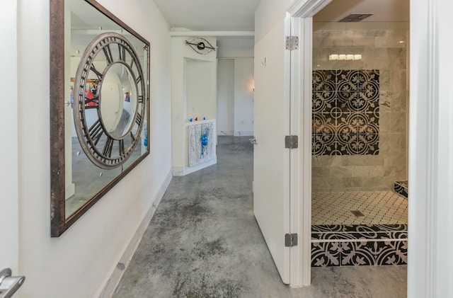 hallway with concrete flooring