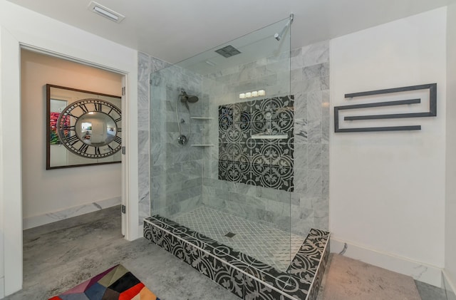 bathroom with tiled shower