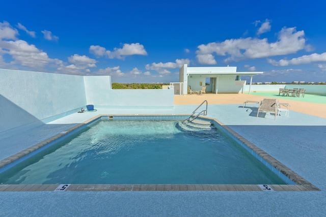 view of pool featuring a patio