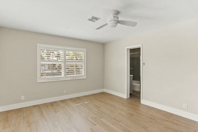 empty room featuring ceiling fan and light hardwood / wood-style floors