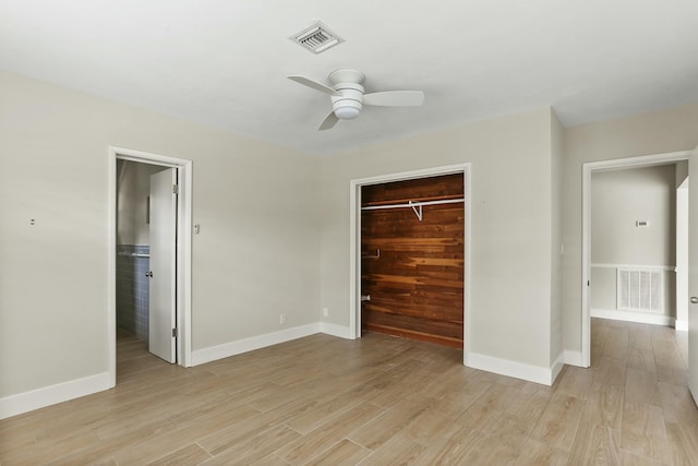 unfurnished bedroom with a closet, ceiling fan, and light wood-type flooring