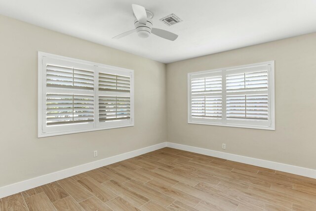 unfurnished room with ceiling fan and light hardwood / wood-style flooring