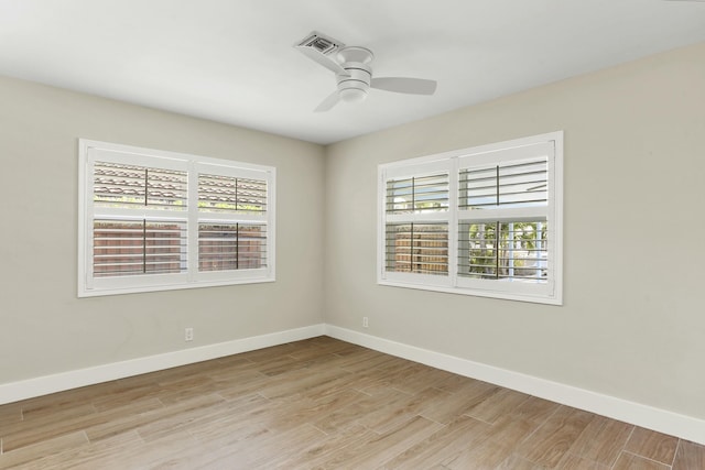 unfurnished room featuring light hardwood / wood-style flooring and ceiling fan