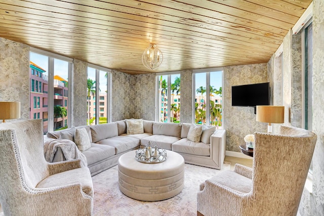 living room with wood ceiling and a notable chandelier