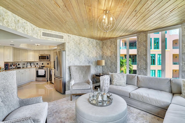 living room with an inviting chandelier and wooden ceiling