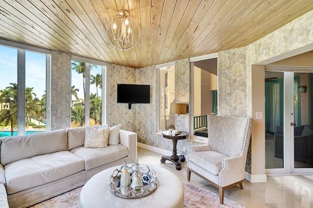 living room featuring wood ceiling and an inviting chandelier