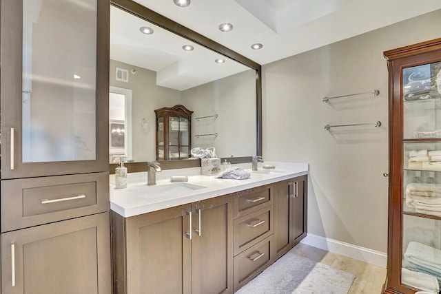 bathroom with vanity and hardwood / wood-style floors