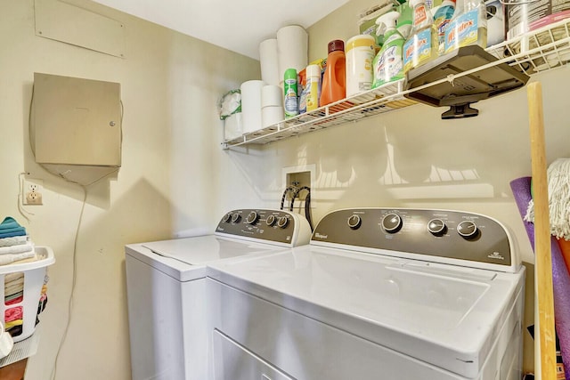 laundry room featuring washing machine and clothes dryer