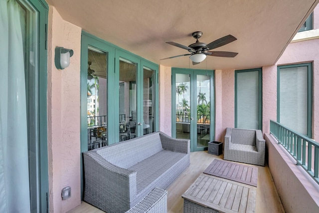 sunroom / solarium featuring ceiling fan