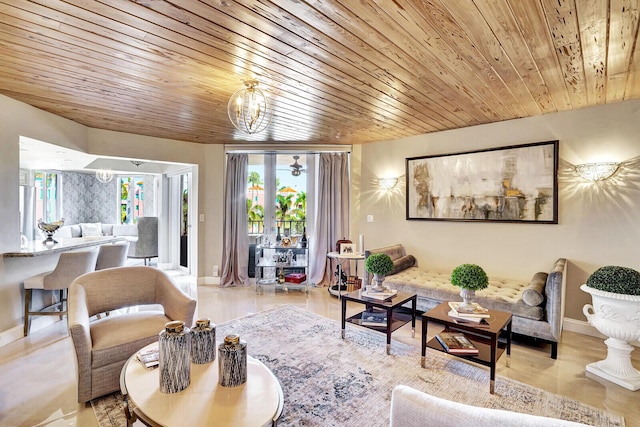 living room with an inviting chandelier and wooden ceiling