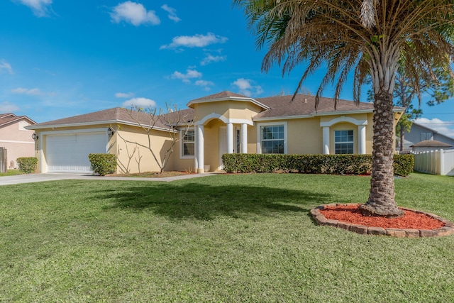 view of front of property featuring a garage and a front yard