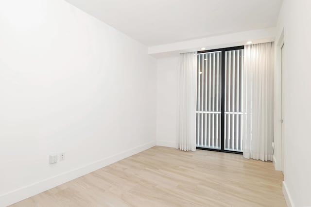 spare room featuring light hardwood / wood-style flooring