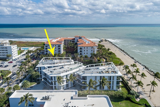 bird's eye view with a beach view and a water view