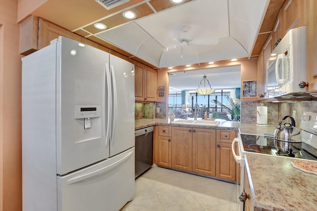 kitchen with decorative light fixtures, tasteful backsplash, sink, light tile patterned floors, and white appliances