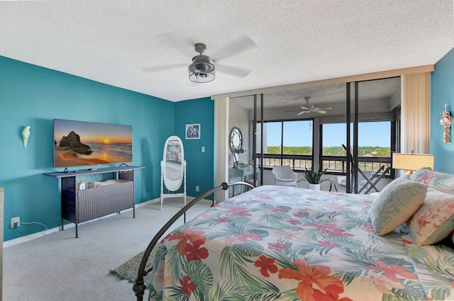 carpeted bedroom featuring ceiling fan, a textured ceiling, and access to outside