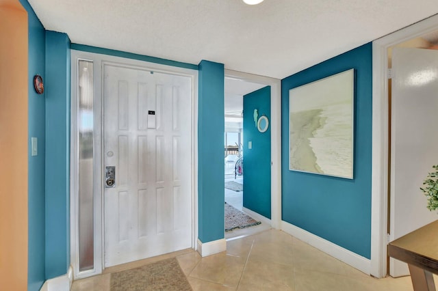 foyer with light tile patterned floors