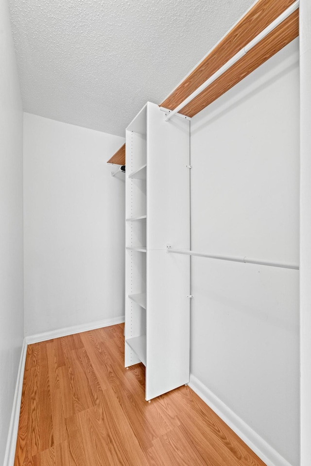 walk in closet featuring light wood-type flooring