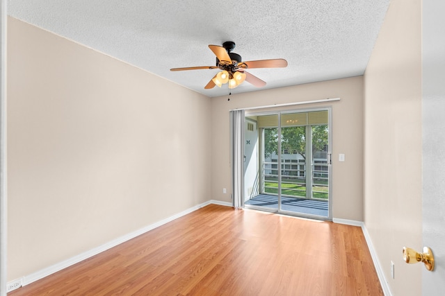 unfurnished room featuring ceiling fan, a textured ceiling, and light wood-type flooring