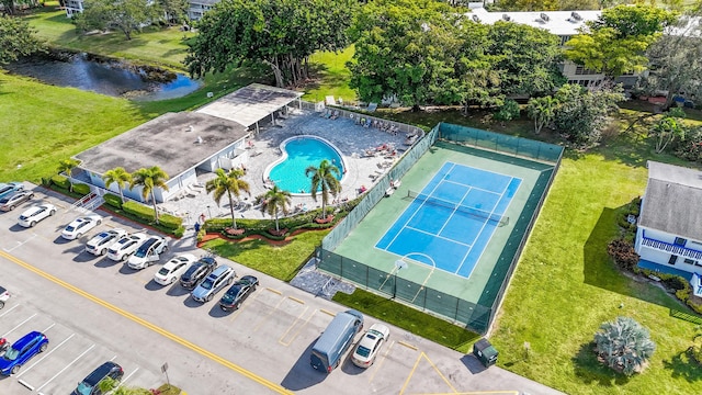 birds eye view of property with a water view