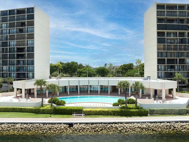 view of pool with a water view