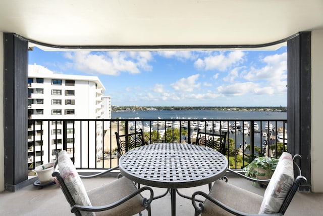 balcony featuring a water view