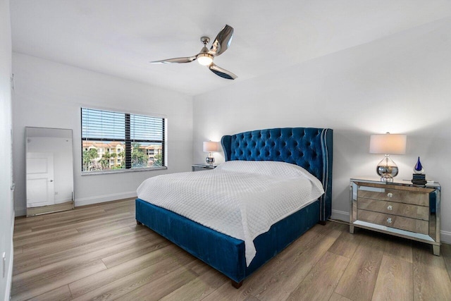 bedroom featuring light hardwood / wood-style flooring and ceiling fan