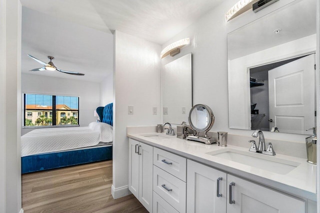 bathroom with vanity, wood-type flooring, and ceiling fan