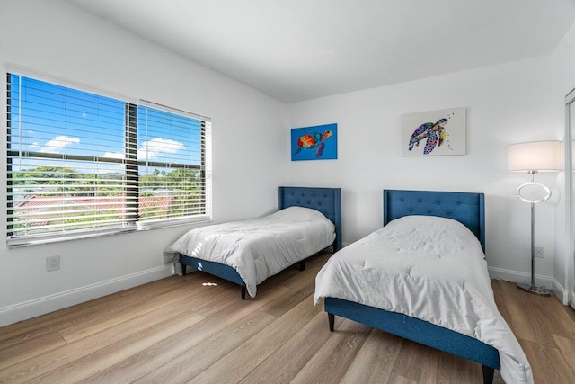 bedroom with light hardwood / wood-style flooring