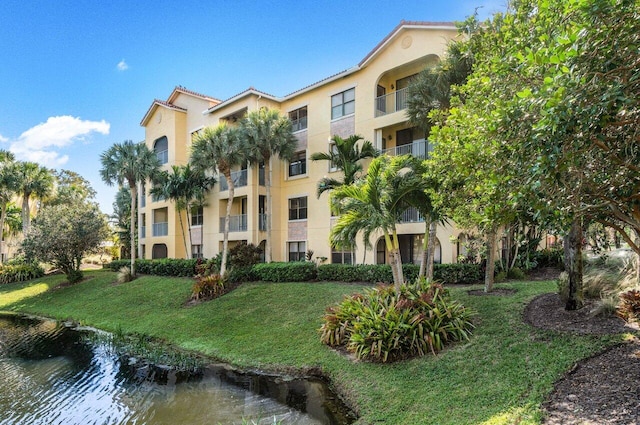 view of building exterior featuring a water view