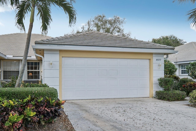 garage with concrete driveway