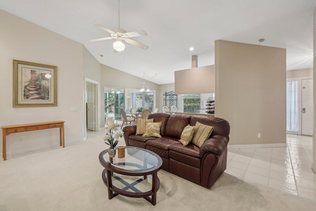 living room featuring baseboards, vaulted ceiling, a ceiling fan, and light carpet
