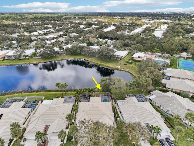 drone / aerial view with a residential view and a water view