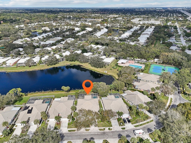 birds eye view of property featuring a residential view and a water view