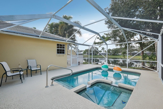 view of swimming pool featuring a patio area, a lanai, a pool with connected hot tub, and a water view