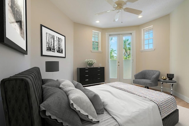 bedroom featuring ceiling fan, access to outside, french doors, and wood-type flooring