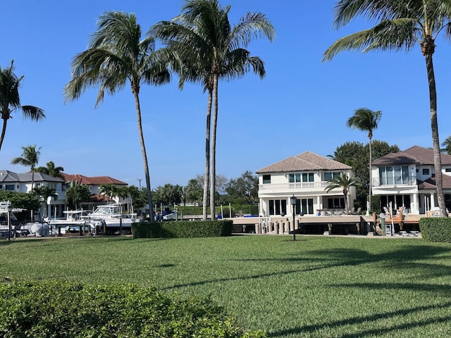 view of home's community with a yard