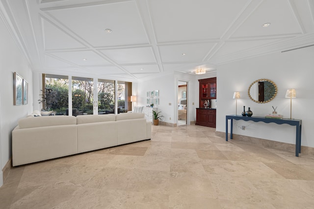 living area with coffered ceiling, crown molding, and baseboards
