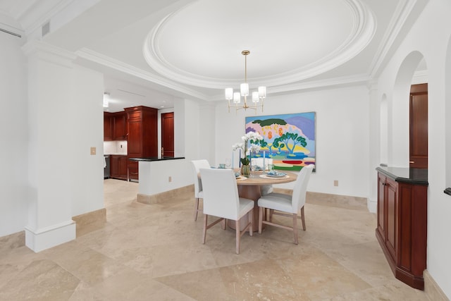 dining area with a chandelier, a raised ceiling, crown molding, and baseboards