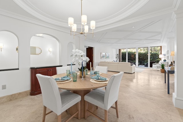 dining room with an inviting chandelier, baseboards, and crown molding