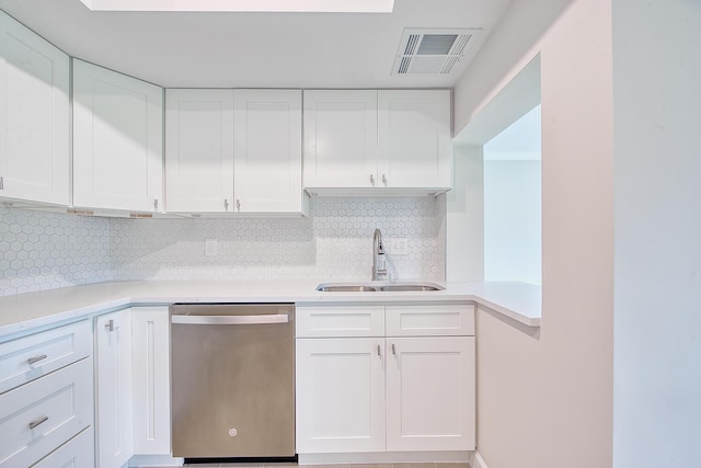 kitchen with sink, decorative backsplash, stainless steel dishwasher, and white cabinets